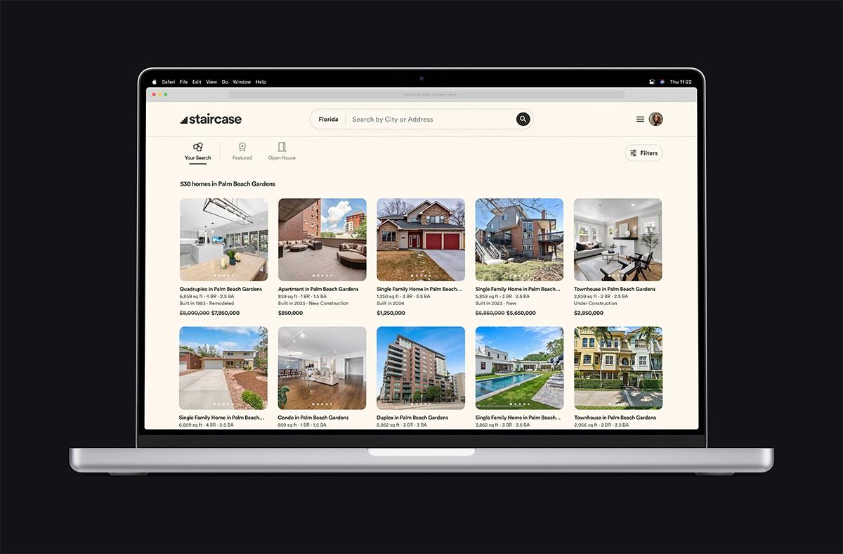 Staircase Listings App running on a MacBook